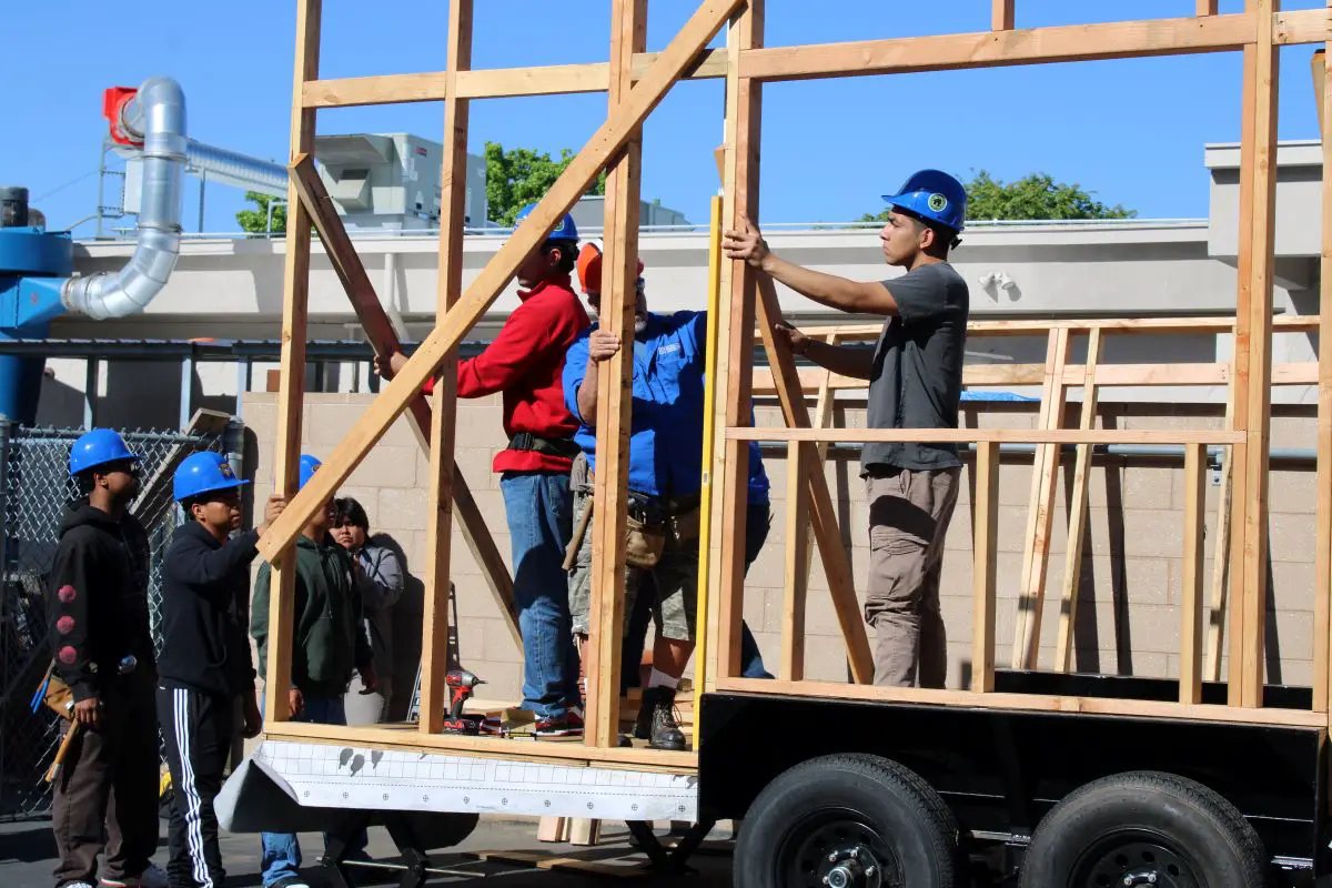 Woodshop students at San Pasqual High School raised the walls on a tiny home the class is buidling for the Warrior Village Project. Photo by Rita Alatorre