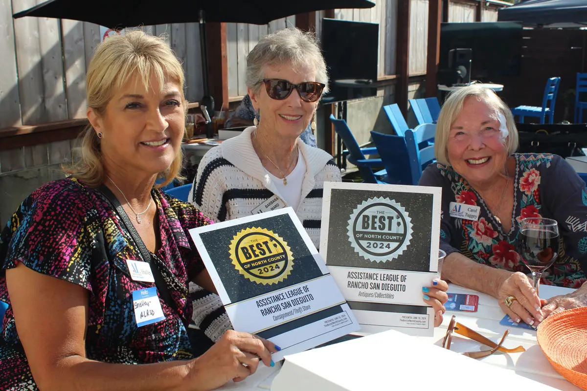 Representatives with Assistance League of Rancho San Dieguito hold up their awards at the 2nd annual Best of North County winner’s party on July 17 at The Leucadian Bar. Photo by Chris Kydd