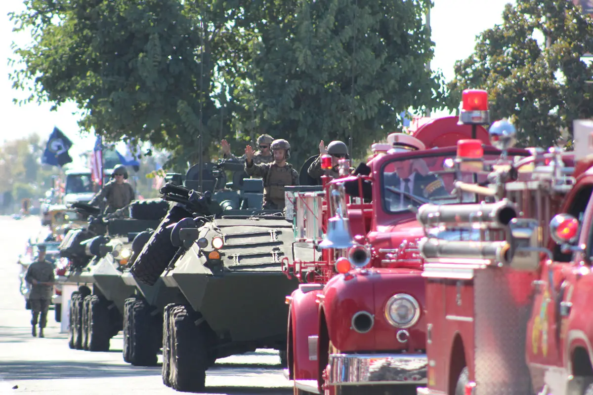 Fire trucks and military vehicles slowly cruise down Main Avenue on Nov. 11 in Fallbrook during a Veterans Day Parade. Photo by Samantha Nelson