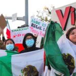 Community members protest increased ICE enforcement and deportation in Escondido on Jan. 29. Photo by Samantha Nelson