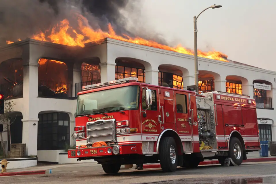 A commercial building burns in Los Angeles during the Palisades Fire. Photo by Cal Fire