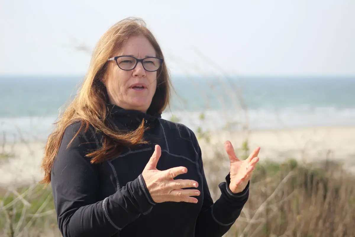 Sherri Sullivan, coastal and riparian ecosystems manager for Marine Corps Base Camp Pendleton, explains the environmental conservation management her team performs along the base’s training beach behind her. The beach is where SeaWorld returned two female sea lions back into the wild after a stay in rehab due to health issues. Photo by Samantha Nelson