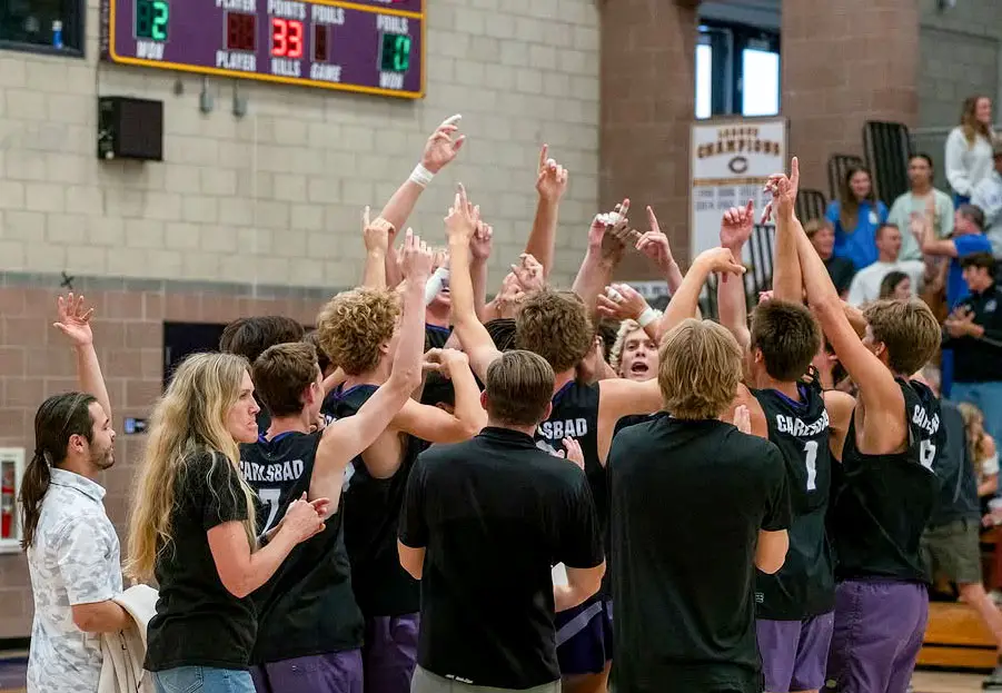 The Lancers boys volleyball team celebrates after a victory. Courtesy photo