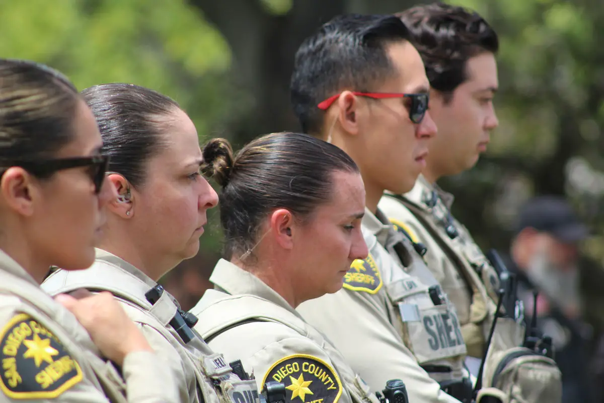 San Diego County Sheriff's Office deputies  stand quietly during a Memorial Day event on May 26 in Fallbrook. Photo by Samantha Nelson