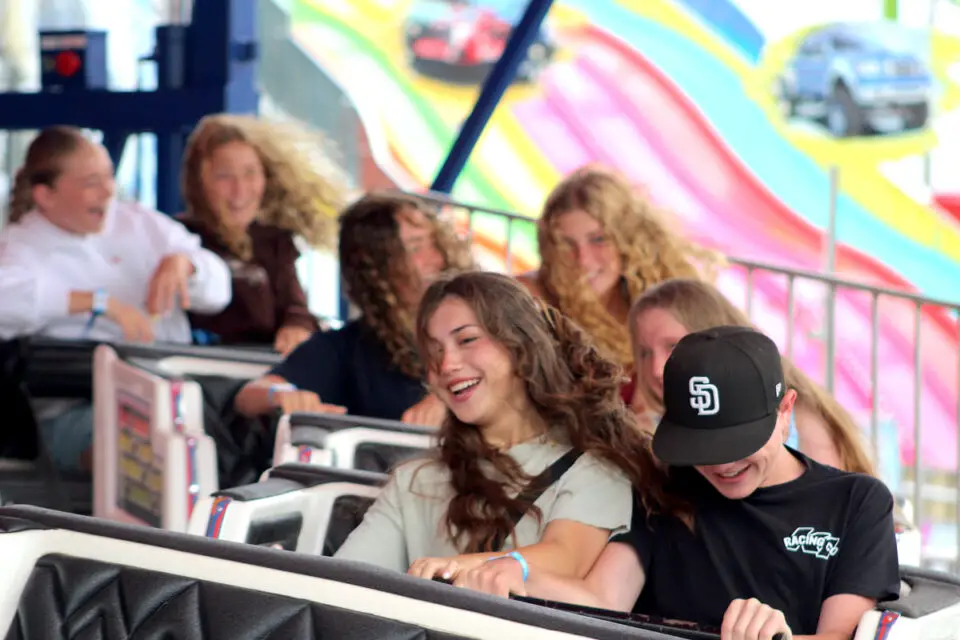 Siblings Gabi and Alec Sancarranca ride the Thunderfest on the opening day of the 2025 San Diego County Fair on Wednesday. The fair is open Wednesdays to Sundays through July 6. Photo by Leo Place
