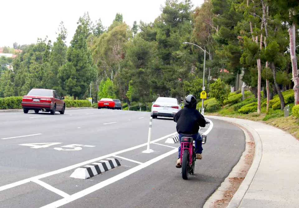 A cyclist heads down South Melrose Drive near Shadowridge Drive in Vista. Photo by Leo Place