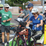 State Sen. Catherine Blakespear gets on her bike following an Aug. 23 event on Santa Fe Drive in Encinitas. Photo by Cameron Adams