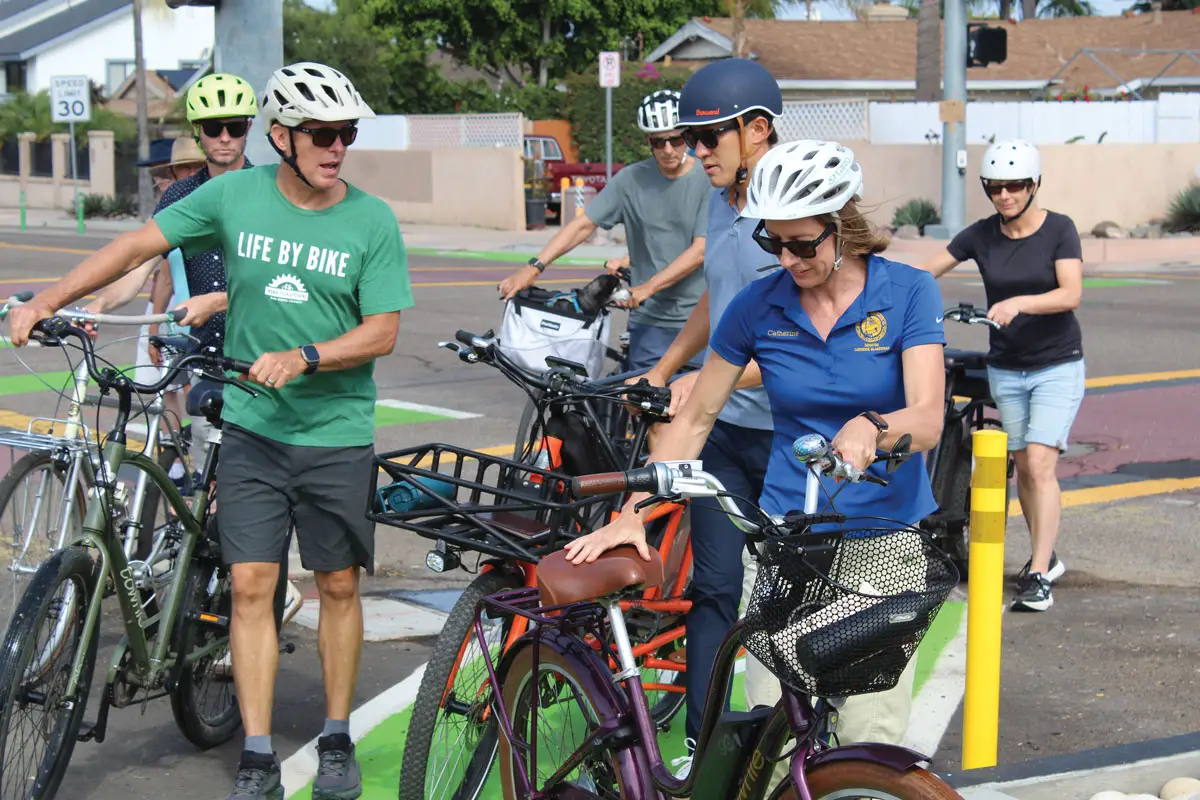 State Sen. Catherine Blakespear gets on her bike following an Aug. 23 event on Santa Fe Drive in Encinitas. Photo by Cameron Adams