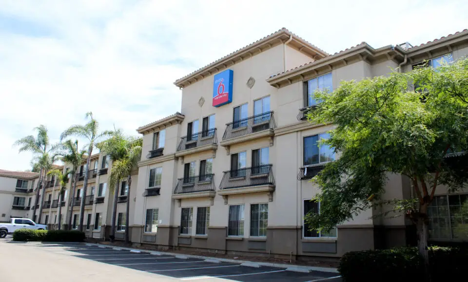 The 98-room Studio 6 hotel at Avenida Encinas and Cannon Road will be converted into housing. Photo by Leo Place