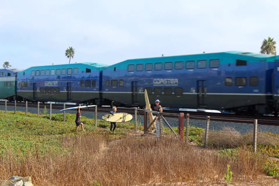Residents consider crossing the railroad tracks near Verdi Avenue in Encinitas before turning around. The city is planning a new pedestrian undercrossing at this site for around $17 million. Photo by Leo Place