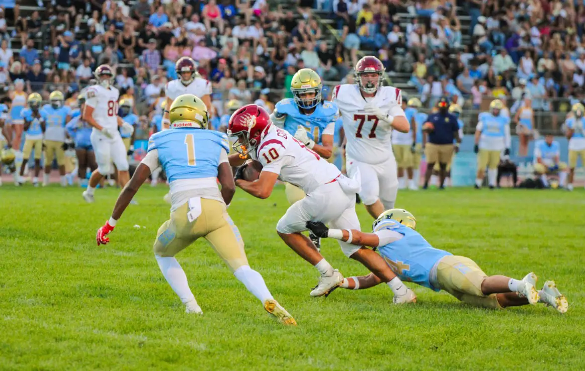Mission Hills senior wide receiver Josh Gonzales hauls in a pass during the Grizzlies' season opener against Quartz Hill. Photo by Johnathan Marron