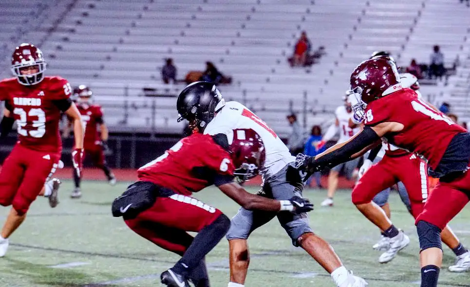 RBV defenders swarm a Canyon Hills runner, forcing a key stop. Photo by Nolan Isa