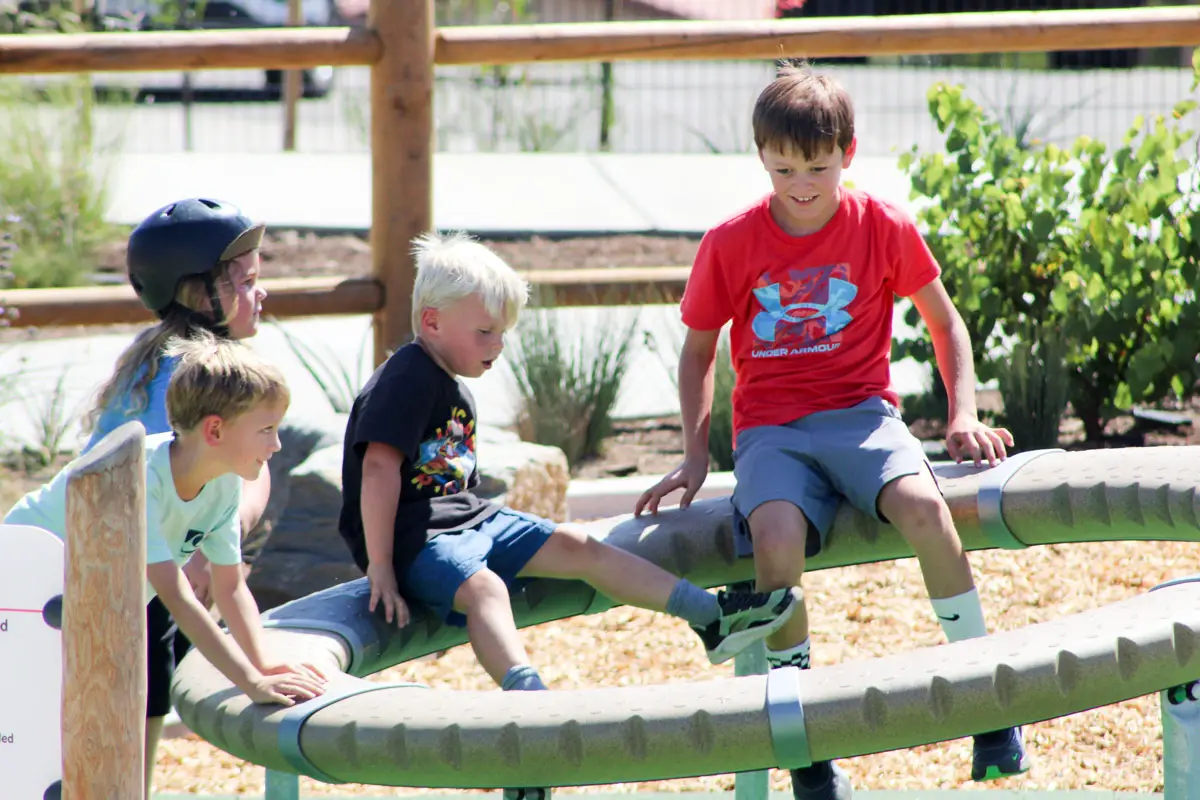 Children test out the new playground equipment on Sept. 3 at Village View County Park in Fallbrook. Photo by Samantha Nelson