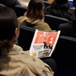 Attendees hold signs protesting U.S. Immigration and Customs Enforcement at a Sept. 17 Oceanside City Council meeting. Photo by Samantha Nelson