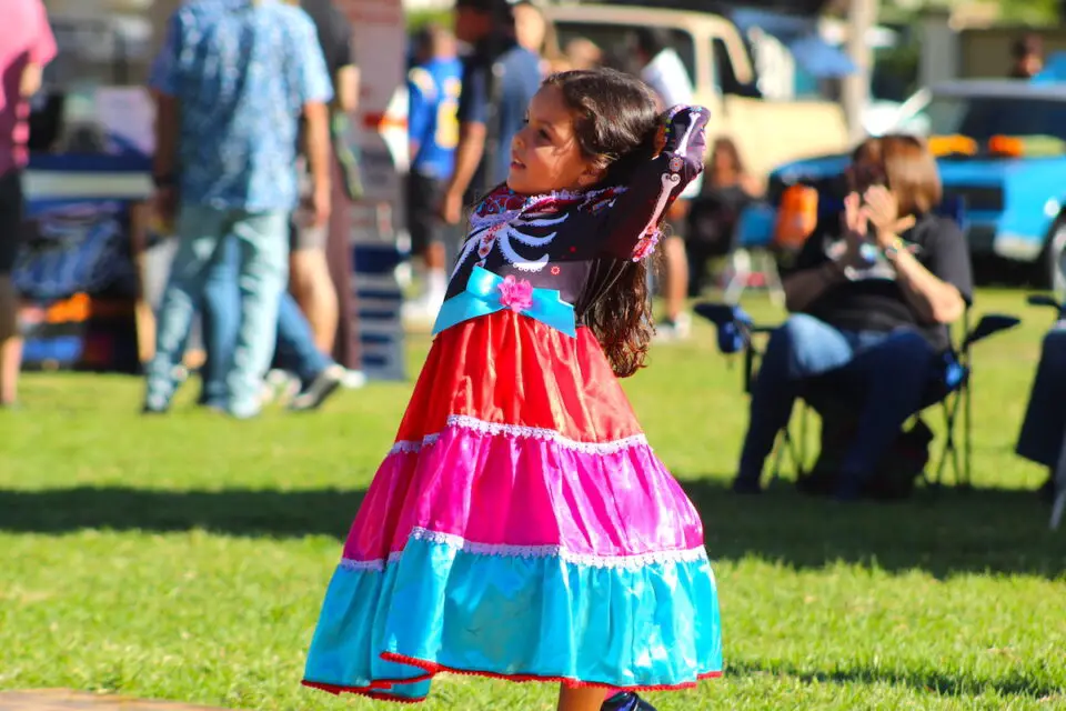 Five-year-old Quinn dances to the live music at the Día de los Muertos celebration in La Colonia Park on Sunday. Photo by Leo Place