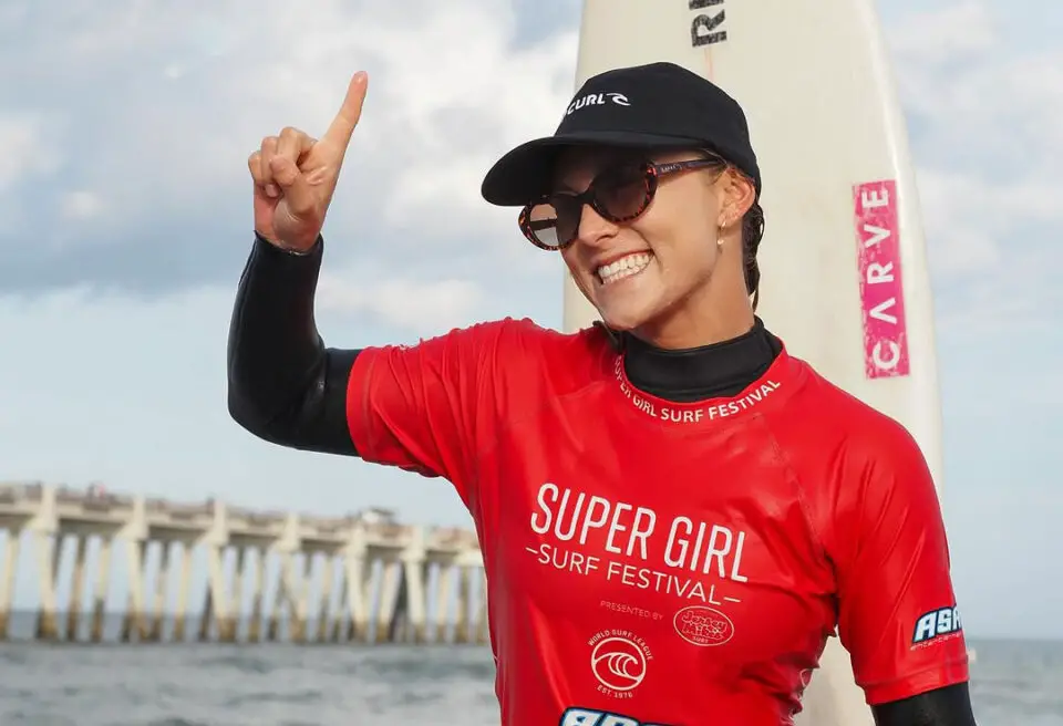 Alyssa Spencer carried out of the water after winning third Super Girl Surf Pro. Courtesy of WSL/Andrew Nichols