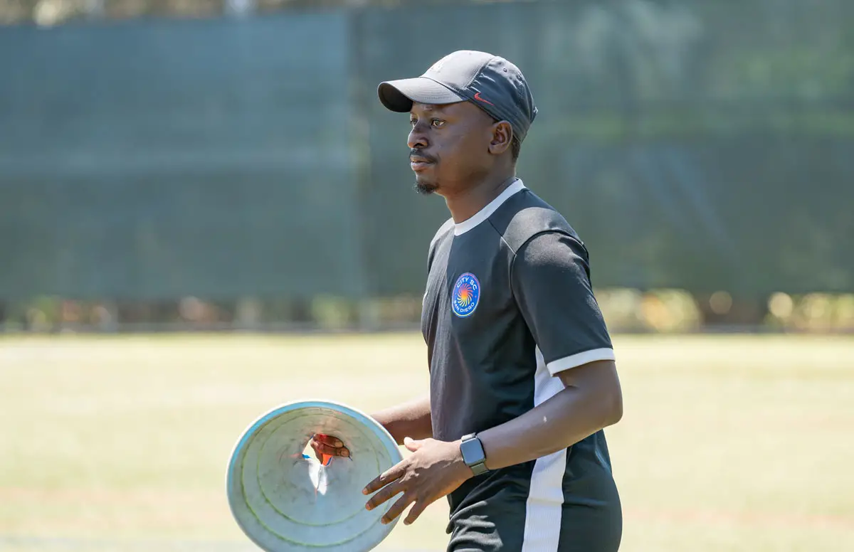 Coach Tapiwa “Taps” Manhungo leads players through drills during a City SC Carlsbad practice. Photo by Tanya Perez
