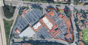 An aerial view of Lomas Santa Fe Plaza shopping center shows the buildings that would be affected by a proposed housing redevelopment project, outlined in red. Over two dozen businesses could potentially be displaced. Google Earth image