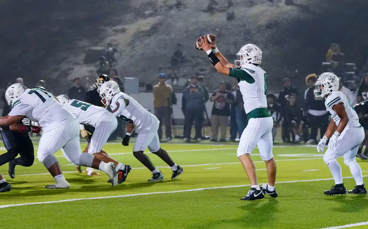 Oceanside’s offense lines up for a snap through heavy fog in the second half of the Battle of Oceanside rivalry game on Oct. 30. The Pirates scored three rushing touchdowns and held El Camino scoreless in a 22-0 victory. Photo by Lajos Kamocsay