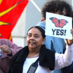 Over 100 people gathered outside the Vista Civic Center on Tuesday in support of a resolution protecting due process rights and community safety, which passed in a 3-2 vote. Photo by Leo Place