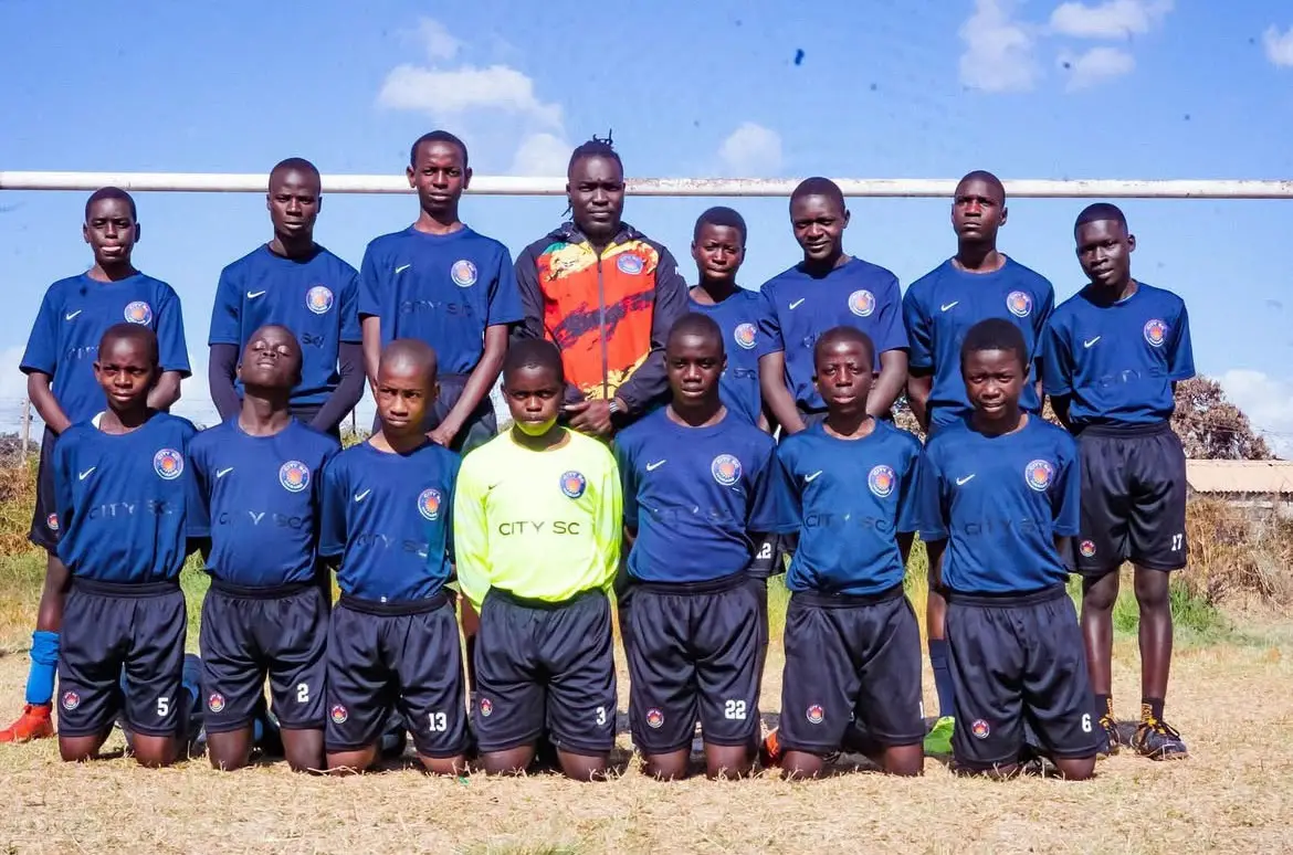 Members of City SC Harare pose for a team photo in Zimbabwe, where the free youth club provides training, meals and mentorship. Courtesy photo/Manhungo