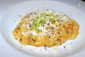 Parmigiano risotto accented by pumpkin and Italian sausage paired with 2022 Joseph Phelps Napa Valley Cabernet Sauvignon. Photo by Rico Cassoni