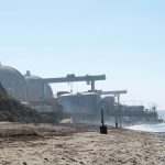 The twin containment domes at the decommissioned San Onofre Nuclear Generating Station are seen along the coastline near San Onofre State Beach. Photo by Falcon 6 Media