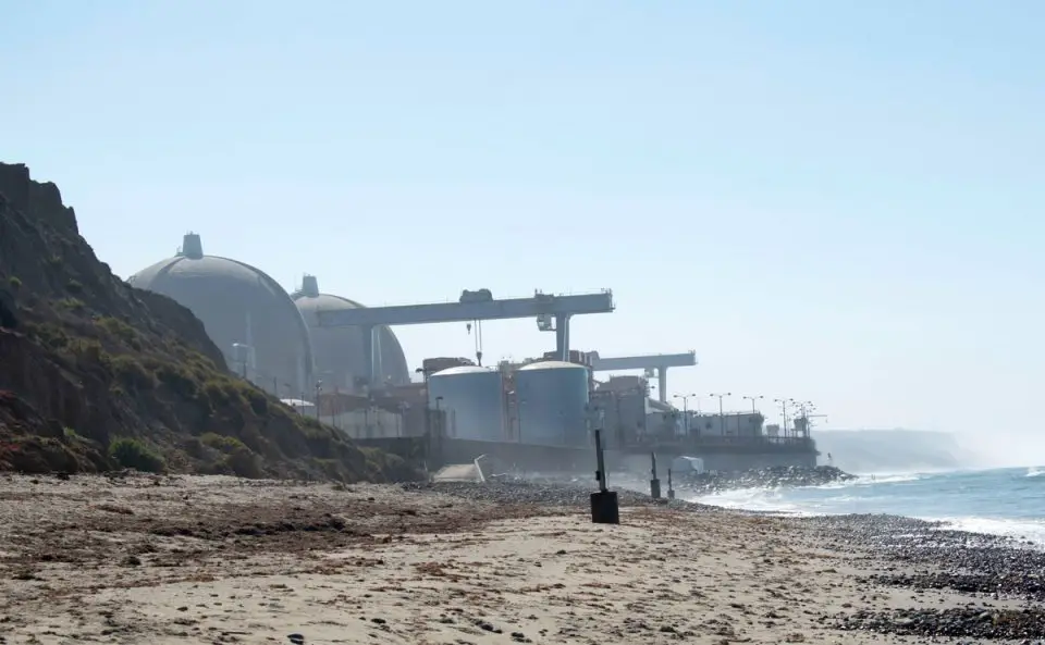 The twin containment domes at the decommissioned San Onofre Nuclear Generating Station are seen along the coastline near San Onofre State Beach. Photo by Falcon 6 Media
