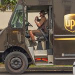 A UPS delivery truck travels along a neighborhood route. The company’s trademark brown has become one of the most recognizable brand colors in the world. Courtesy photo/Adobe