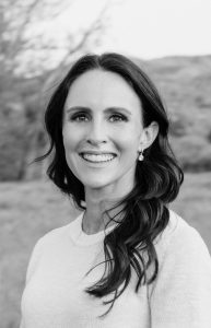 Mental performance coach Alli Smith of Raising Strength smiling outdoors