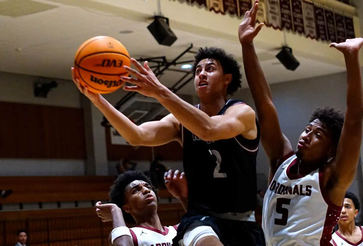 Longhorns senior guard CJ Aldrich drives to the hoop against Laguna Creek on Dec. 29 in Vista. Photo by Nolan Isa 