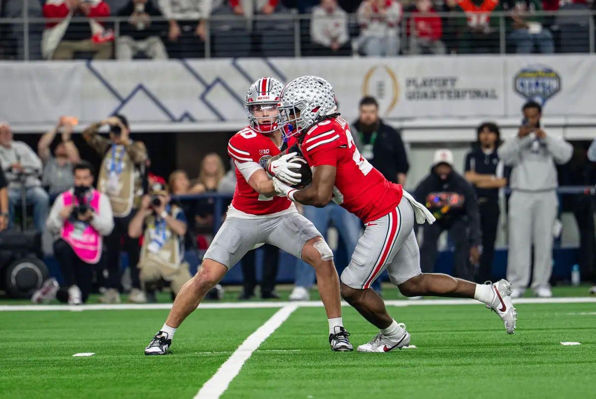 Carlsbad alum and Ohio State quarterback Julian Sayin hands off to running back Bo Jackson during the Buckeyes’ College Football Playoff quarterfinal loss to Miami at the Cotton Bowl. Courtesy photo/OSU Football