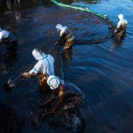 Crews clean up the MV Wakashio oil spill off the southern coast of Mauritius, an island nation in the Indian Ocean. Courtesy photo