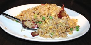 Wok-tossed Mandarin fried rice with BBQ pork, eggs, peas, scallions, onions and bean sprouts.<br />Photo by Rico Cassoni