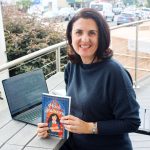 Encinitas author Huda Al-Marashi holds her new book, "Hail Mariam." Photo by Cameron Adams