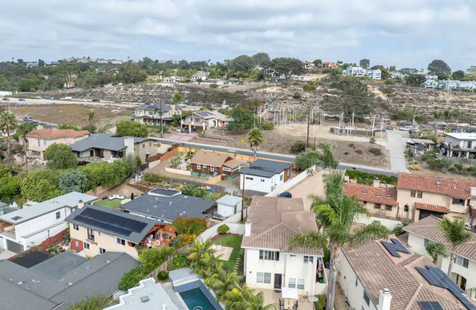 An aerial view of homes and condominiums in Del Mar, where the California Coastal Commission has approved new short-term rental rules capping future permits at 129 citywide while allowing about 150 existing operators to continue under grandfather provisions. Courtesy photo/Unwind