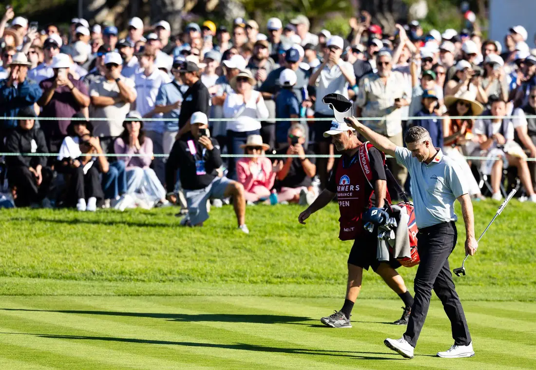 Justin Rose walks down the fairway and salutes the crowd after sealing his win at this year's Farmers Insurance Open at Torrey Pines Golf Course. Courtesy photo/Farmers Open