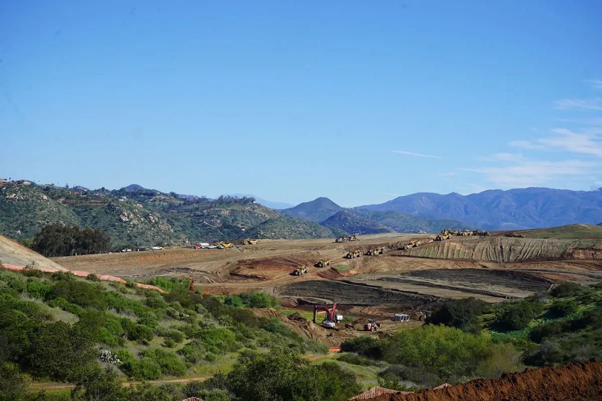 Scrapers and bulldozers grade the 134-acre Ocean Breeze Ranch site in Bonsall as construction begins on a five-neighborhood residential development. Photo by Jordan P. Ingram