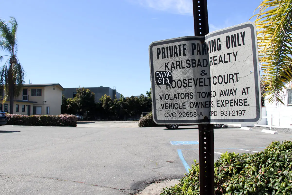 A parking sign next to Karlsbad Realty in Carlsbad Village. Photo by Jordan P. Ingram