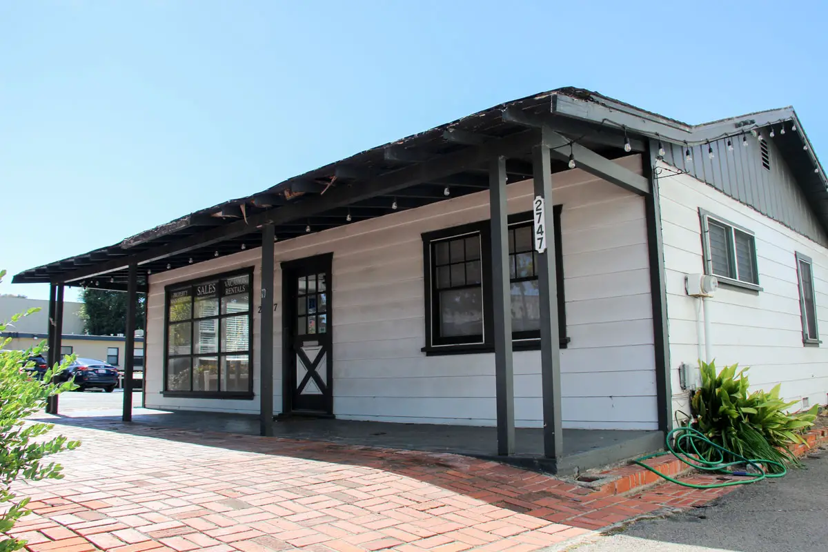 The Karlsbad Realty building on Roosevelt Street in Carlsbad Village. The building will be demolished to make way for the four-story, mixed-use building with 33 condos and retail space. Photo by Jordan P. Ingram