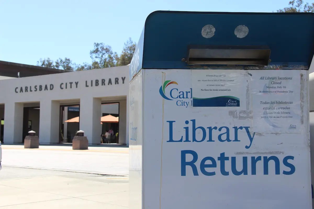 A drive-thru book return bin at the Carlsbad City Library on Dove Lane. Photo by Cameron Adams