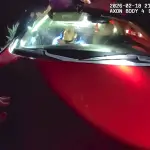 Police body camera footage shows Andre Mendez moments before he was fatally shot by police in San Marcos on Feb. 18. Law enforcement said he was holding a gun inside the car and fired it once before six officers discharged their weapons. Screenshot/San Diego County Sheriff's Department