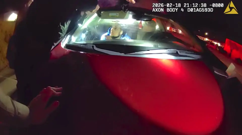 Police body camera footage shows Andre Mendez moments before he was fatally shot by police in San Marcos on Feb. 18. Law enforcement said he was holding a gun inside the car and fired it once before six officers discharged their weapons. Screenshot/San Diego County Sheriff's Department