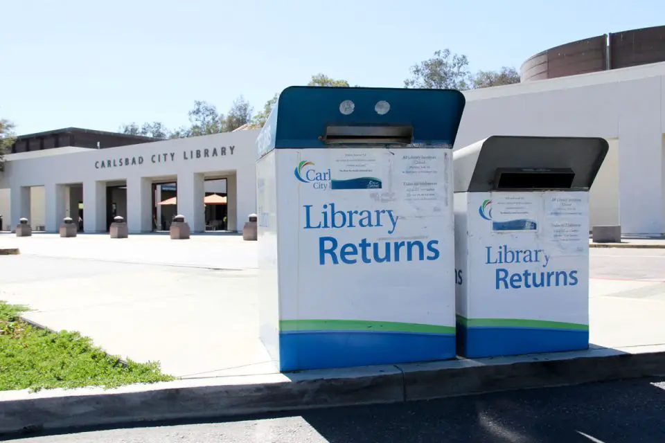 A drive-thru book return bin at the Carlsbad City Library on Dove Lane. Photo by Cameron Adams