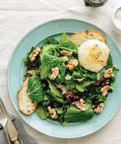 Show off your garden greens with the baked goat cheese with spring lettuce salad from Chez Panisse in Berkeley. Photo via thekitchn.com/Kimberley Hasselbrink