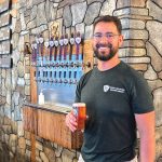 Mike Howell, head brewer at Barley & Sword, serving up a pint at The Tavern in Escondido. Photo by Jeff Spanier