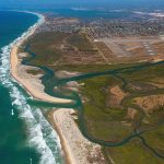 An aerial view of the Tijuana Slough and San Diego Bay national wildlife refuges near the U.S.-Mexico border. Photo by Ralph Lee Hopkins