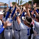 Cal State San Marcos players celebrate after the top-seeded Cougars powered past Cal State Monterey Bay, 14-4, in five innings on Friday in San Marcos. Photo by Greg Siller/CSUSM Athletics