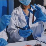 Medical professionals reviewing a blood sample during toxicology testing related to a DUI accident investigation.