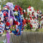 Local veterans and political organizations lay wreaths honoring fallen service members during a Memorial Day ceremony at Oak Hill Memorial Park in Escondido. Photo by Samantha Nelson